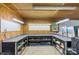 Functional garage workspace featuring a large work table and organized shelving at 3980 English Oak Dr, Lincolnton, NC 28092