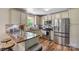 Modern kitchen with stainless steel appliances, granite countertops, and ample cabinet space at 3980 English Oak Dr, Lincolnton, NC 28092