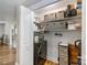 Organized laundry closet offers storage and convenience with washer, dryer, shelves, and organizing cart at 3980 English Oak Dr, Lincolnton, NC 28092