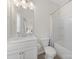 Bright bathroom with a white vanity, toilet, and shower/tub combo at 416 Linestowe Dr, Belmont, NC 28012