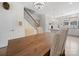 Bright dining area with a wooden table, upholstered chairs, and modern chandelier lighting at 416 Linestowe Dr, Belmont, NC 28012