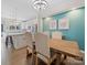 Elegant dining room with a rustic table, stylish chairs, and views of the kitchen at 416 Linestowe Dr, Belmont, NC 28012