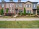 Charming townhome features a brick facade, well-maintained landscaping, and inviting entryway at 416 Linestowe Dr, Belmont, NC 28012