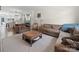 Cozy living room featuring comfortable seating, modern rug, and abundant natural light at 416 Linestowe Dr, Belmont, NC 28012