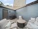 Outdoor patio featuring a gas grill, comfortable seating, and a shaded canopy at 416 Linestowe Dr, Belmont, NC 28012