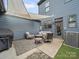 Back patio with outdoor seating, grill, and shade canopy at 416 Linestowe Dr, Belmont, NC 28012