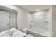 Bright bathroom features a shower-tub combo, white fixtures, and a vanity with mirror at 416 Moondance Dr # 121, Gastonia, NC 28054