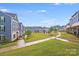 Beautiful community green space, sidewalks, and well-maintained apartment building exteriors at 416 Moondance Dr # 121, Gastonia, NC 28054