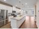 Modern kitchen with white cabinets, granite countertops, stainless steel appliances and wood flooring at 416 Moondance Dr # 121, Gastonia, NC 28054