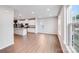 Bright living room featuring wood floors and connecting kitchen and dining area at 416 Moondance Dr # 121, Gastonia, NC 28054
