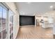 Bright, open living room with hardwood floors adjacent to sliding glass door and modern kitchen at 416 Moondance Dr # 121, Gastonia, NC 28054