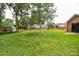 Expansive backyard with shed, mature trees, and privacy fence, perfect for outdoor activities at 4320 Atkinson Way, Monroe, NC 28110