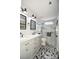 Bright bathroom with double sinks, modern lighting, decorative mirrors, and large glass enclosed shower with marble accent at 4320 Atkinson Way, Monroe, NC 28110