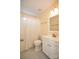 Well-lit bathroom with standard bathtub and shower, white vanity and mirror, and retro tiled flooring at 4320 Atkinson Way, Monroe, NC 28110
