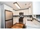Modern kitchen featuring stainless steel appliances, white cabinets, and stylish backsplash at 4320 Atkinson Way, Monroe, NC 28110