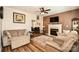 Inviting living room with cozy seating, a fireplace, and wood-look flooring at 4320 Atkinson Way, Monroe, NC 28110