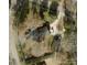 Aerial view of property featuring mature trees, long driveway and multiple parking spaces at 441 Crestside Se Dr, Concord, NC 28025