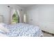 Bright bedroom featuring hardwood floors, neutral walls, white trim, and natural light from a window at 441 Crestside Se Dr, Concord, NC 28025