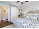 Bright bedroom features a floral patterned bedspread, and custom built in shelving at 441 Crestside Se Dr, Concord, NC 28025