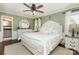 Calming bedroom with hardwood floors, light green walls, and bright natural light from the windows at 441 Crestside Se Dr, Concord, NC 28025
