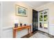 Inviting foyer with wood floors, light walls, hall table, and a front door view of the greenery outside at 441 Crestside Se Dr, Concord, NC 28025