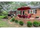 Charming brick patio with outdoor seating, grill, and lush landscaping perfect for entertaining at 441 Crestside Se Dr, Concord, NC 28025