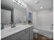 Well-lit bathroom featuring a large vanity with ample counter space and a shower-tub combo at 4607 Silk Tree Ln, Rock Hill, SC 29732