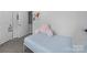Bright bedroom featuring a bed and doorway leading to bathroom at 4607 Silk Tree Ln, Rock Hill, SC 29732