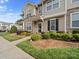 Charming townhouse featuring stone accents, well-maintained landscaping and a inviting entrance at 4607 Silk Tree Ln, Rock Hill, SC 29732