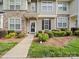 Inviting townhouse exterior showcasing stone accents, tidy landscaping, and a clear pathway at 4607 Silk Tree Ln, Rock Hill, SC 29732