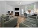 Inviting living room with fireplace, modern decor, and comfortable seating, perfect for relaxing and entertaining at 4607 Silk Tree Ln, Rock Hill, SC 29732