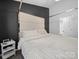 This cozy main bedroom boasts a plush bed, a contemporary design, and easy access to an ensuite bathroom at 4607 Silk Tree Ln, Rock Hill, SC 29732