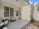 Cozy patio with brick flooring, rocking chairs, and an umbrella at 4607 Silk Tree Ln, Rock Hill, SC 29732