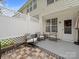 Private patio with brick flooring, rocking chairs, and privacy fence at 4607 Silk Tree Ln, Rock Hill, SC 29732