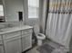Well-lit bathroom featuring a single vanity, toilet, and bathtub-shower combo at 5000 Britannia Blvd, Waxhaw, NC 28173