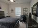 Comfortable bedroom features a double bed, desk area, and modern decor at 5000 Britannia Blvd, Waxhaw, NC 28173