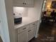 Butler's pantry includes custom cabinetry, and under cabinet lighting at 5000 Britannia Blvd, Waxhaw, NC 28173