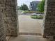 View from the front door shows the long driveway and a glimpse of the surrounding neighborhood at 5000 Britannia Blvd, Waxhaw, NC 28173