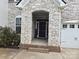 Welcoming front entrance with stone facade and brick steps leading to the front door at 5000 Britannia Blvd, Waxhaw, NC 28173
