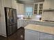 Bright, updated kitchen featuring stainless steel appliances and white cabinetry with ample storage at 5000 Britannia Blvd, Waxhaw, NC 28173