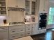 Well-appointed kitchen featuring stainless steel appliances, gas range, and sleek countertops at 5000 Britannia Blvd, Waxhaw, NC 28173