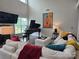 Spacious living room featuring a piano, large windows, comfortable seating, and stylish decor at 5000 Britannia Blvd, Waxhaw, NC 28173