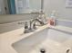 Close-up of bathroom sink with modern faucet and decorative soaps at 5000 Britannia Blvd, Waxhaw, NC 28173