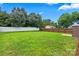 Spacious backyard with a mix of wood and vinyl fencing, offering privacy and security at 5111 Elementary View Dr, Charlotte, NC 28269