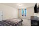 Bedroom with carpet and natural light provides a serene and relaxing space at 5111 Elementary View Dr, Charlotte, NC 28269