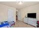Bedroom with neutral walls, carpet, and white trim features a dresser and furnishings for a or young person at 5111 Elementary View Dr, Charlotte, NC 28269