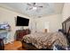 Spacious bedroom with a ceiling fan, hardwood floors, and a tray ceiling provides ample natural light at 5111 Elementary View Dr, Charlotte, NC 28269