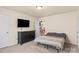 Neutral bedroom with a dresser and TV, offering a comfortable and relaxing space at 5111 Elementary View Dr, Charlotte, NC 28269
