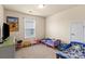 Cozy bedroom with kid-friendly decor, featuring carpeted floors and a bright window at 5111 Elementary View Dr, Charlotte, NC 28269