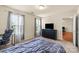 Comfortable bedroom featuring large windows and neutral wall paint at 5111 Elementary View Dr, Charlotte, NC 28269